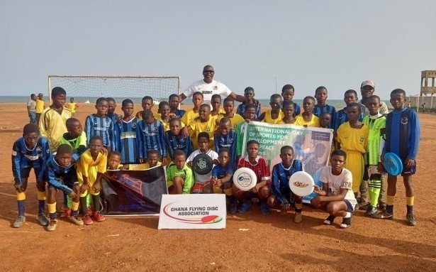 GFDA president, Mr. Desmond Mantey, in a photo with youth athletes from Osu Accra