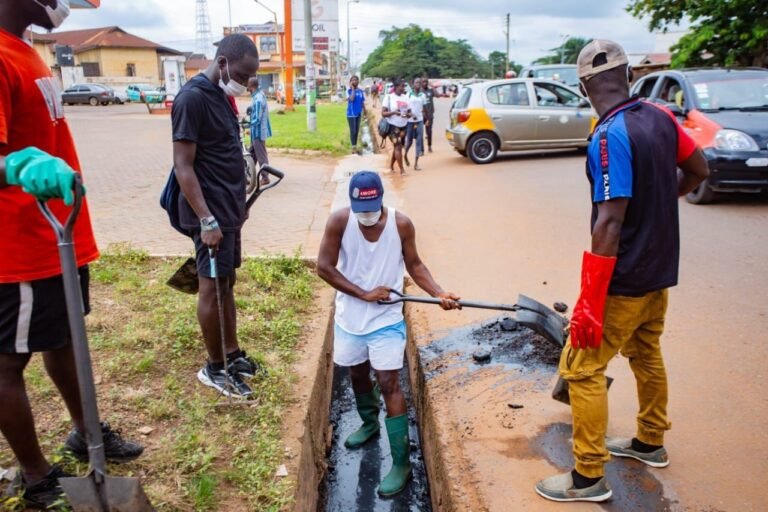 Dennis Obeng Agyei desilting gutters during the clean-up exercise