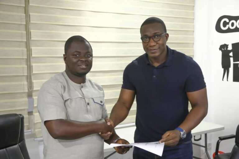 Kofi Baah Agyepong, YEA CEO, in a handshake with BlueSPACE rep after the MoU signing