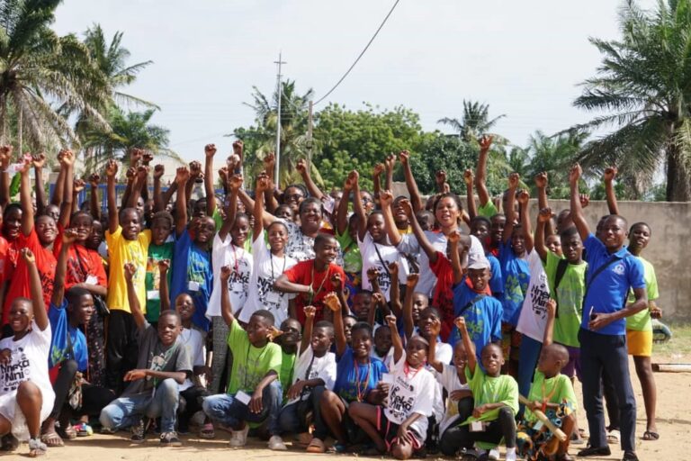 (Standing 8th left) Mrs Cecilia Fiaka, Founder of the Nneka Youth Foundation, with children after the mini-camp