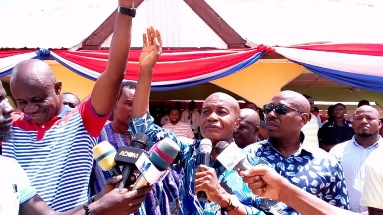 Stephen Ntim, NPP Chair, raises the hand of Charles Opoku