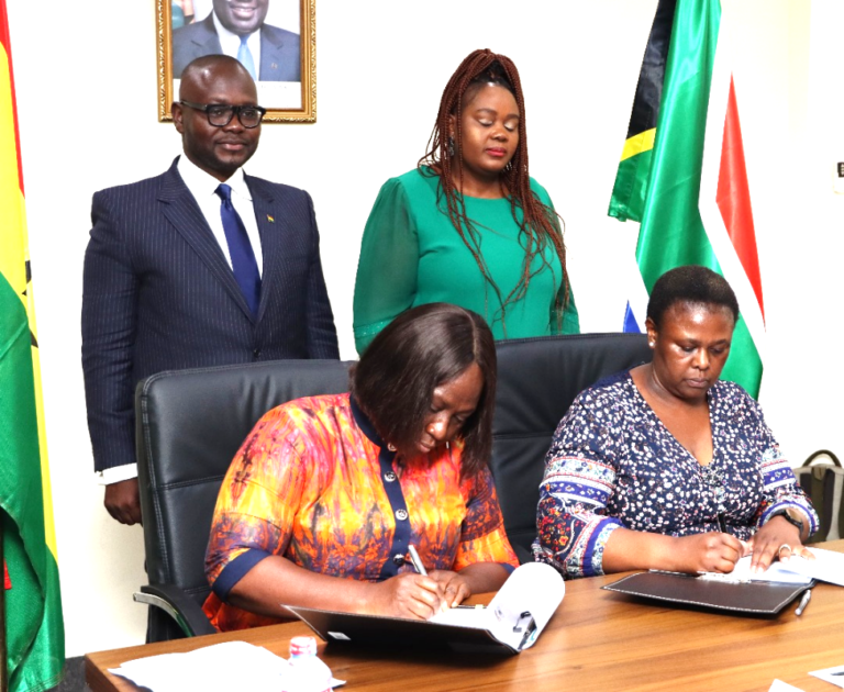 Reps from Ghana and South Africa’s Housing Ministries sign the agreement while Francis Asenso-Boakye and Mmamoloko Kubayi observe the process